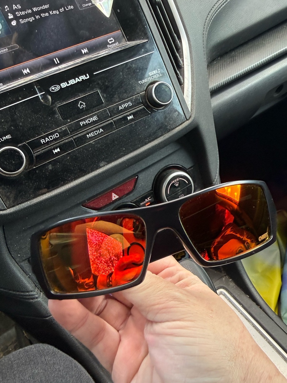 Oakley Black Frame Sunglasses with Red-Orange Mirrored Lenses